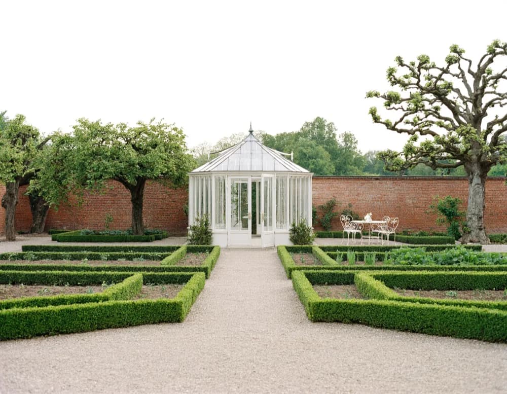 The walled kitchen garden at Haus Bornim with the glass orangery along the south wall